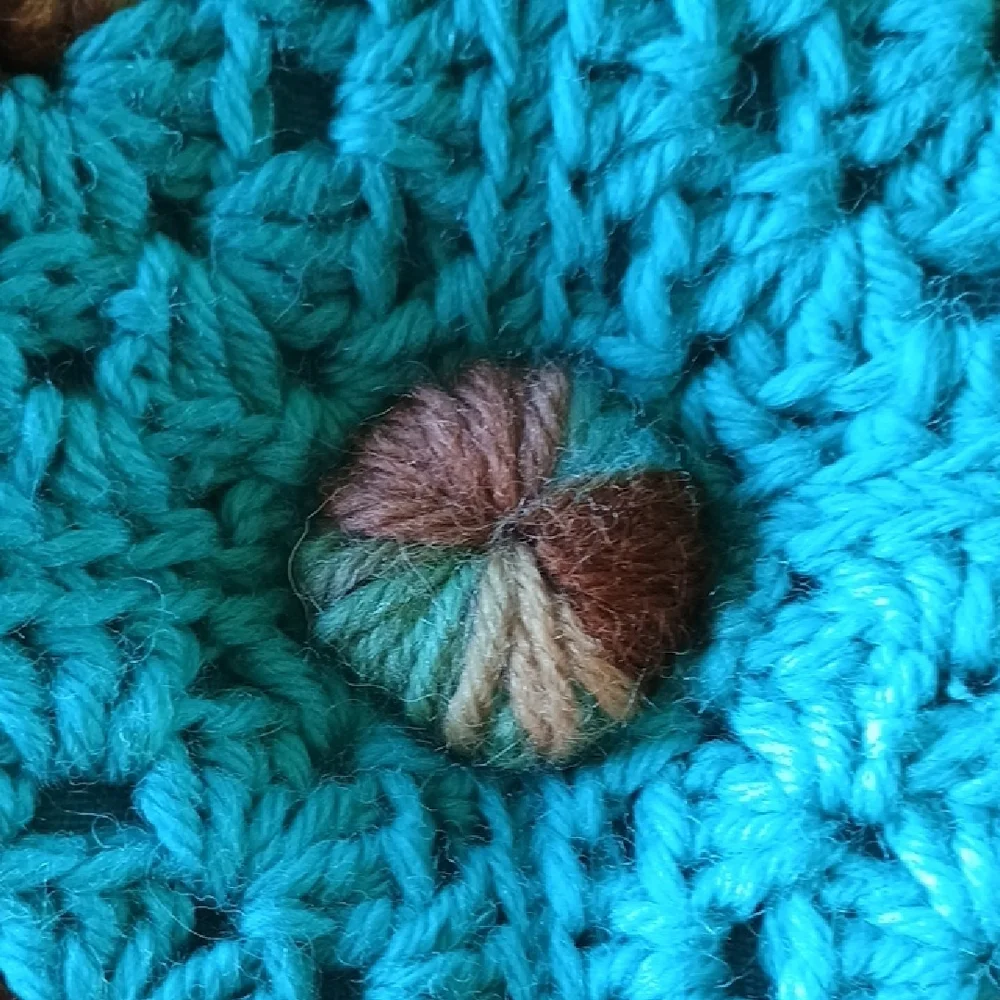 Crocheted Blue and Brown Pillow